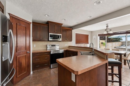 391 Auburn Bay Heights Se, Calgary, AB - Indoor Photo Showing Kitchen With Stainless Steel Kitchen With Double Sink
