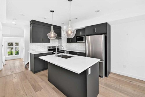 108-1632 20 Avenue Nw, Calgary, AB - Indoor Photo Showing Kitchen With Upgraded Kitchen