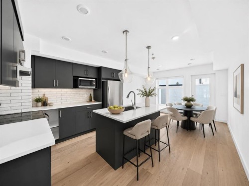 108-1632 20 Avenue Nw, Calgary, AB - Indoor Photo Showing Kitchen With Upgraded Kitchen