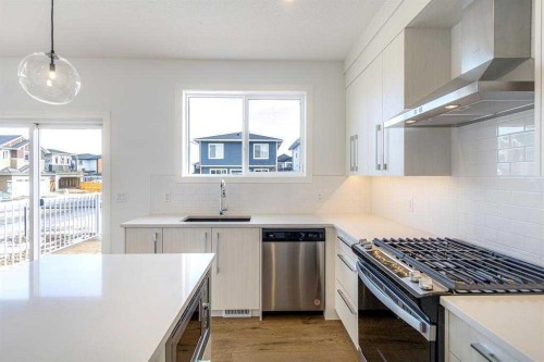 198 Dawson Harbour Hill, Chestermere, AB - Indoor Photo Showing Kitchen With Upgraded Kitchen