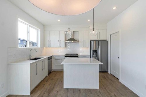 198 Dawson Harbour Hill, Chestermere, AB - Indoor Photo Showing Kitchen With Stainless Steel Kitchen With Upgraded Kitchen