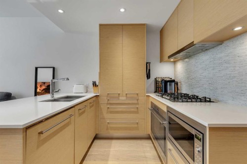 413-1025 5 Avenue Sw, Calgary, AB - Indoor Photo Showing Kitchen With Double Sink