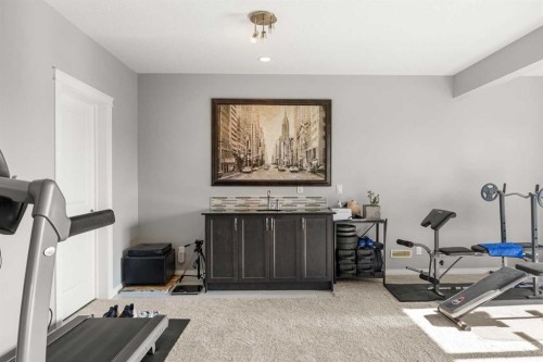 208 Panton Road Nw, Calgary, AB - Indoor Photo Showing Gym Room