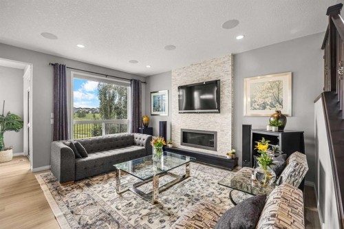 208 Panton Road Nw, Calgary, AB - Indoor Photo Showing Living Room With Fireplace