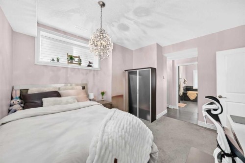 116 Panatella Rise Nw, Calgary, AB - Indoor Photo Showing Bedroom