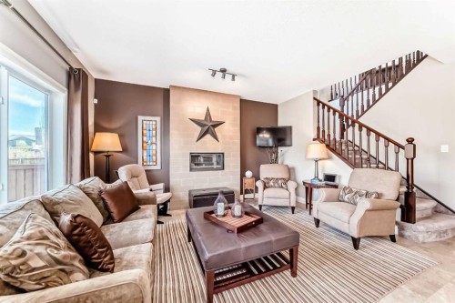 1449 Ravenscroft Avenue Se, Airdrie, AB - Indoor Photo Showing Living Room With Fireplace