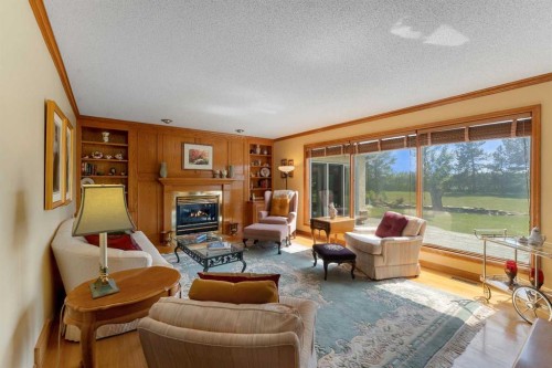 265028 Range Road 44, Rural Rocky View County, AB - Indoor Photo Showing Living Room With Fireplace