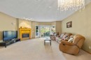 36 Hamptons Link Nw, Calgary, AB  - Indoor Photo Showing Living Room With Fireplace 