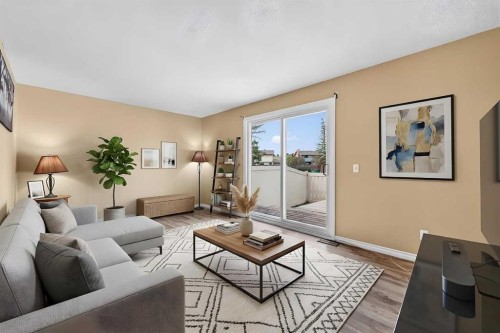 7-14736 Deerfield Drive Se, Calgary, AB - Indoor Photo Showing Living Room