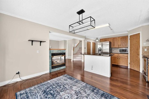 287 Harvest Oak Rise Ne, Calgary, AB - Indoor Photo Showing Kitchen With Fireplace