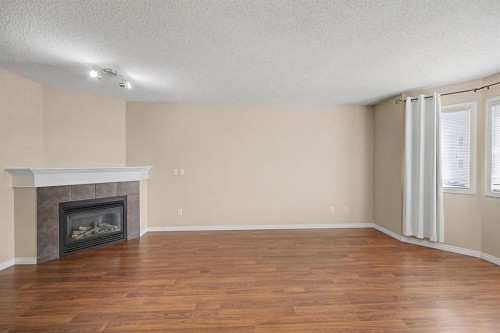 65 Royal Birch Villas Nw, Calgary, AB - Indoor With Fireplace