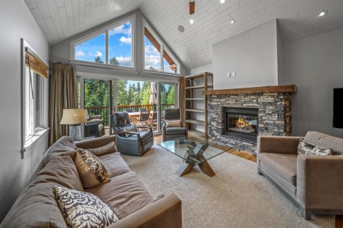 19 Creekside Mews, Canmore, AB - Indoor Photo Showing Living Room With Fireplace