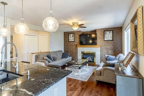 8389 Saddleridge Drive Ne, Calgary, AB - Indoor Photo Showing Living Room With Fireplace