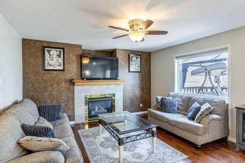 8389 Saddleridge Drive Ne, Calgary, AB - Indoor Photo Showing Living Room With Fireplace