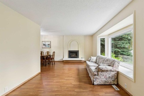 6452 Silver Springs Way Nw, Calgary, AB - Indoor Photo Showing Living Room With Fireplace