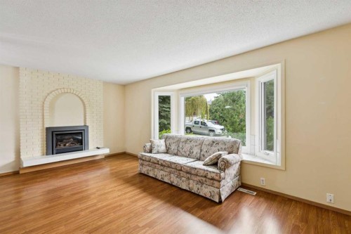 6452 Silver Springs Way Nw, Calgary, AB - Indoor Photo Showing Living Room With Fireplace