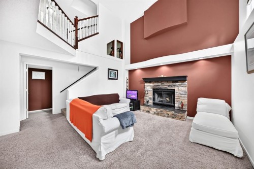 14954 Mt Mckenzie Drive Se, Calgary, AB - Indoor Photo Showing Other Room With Fireplace