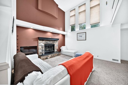 14954 Mt Mckenzie Drive Se, Calgary, AB - Indoor Photo Showing Living Room With Fireplace