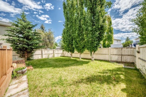 14954 Mt Mckenzie Drive Se, Calgary, AB - Outdoor With Backyard