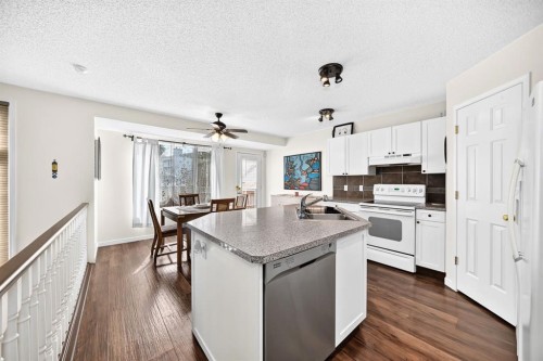 14954 Mt Mckenzie Drive Se, Calgary, AB - Indoor Photo Showing Kitchen With Double Sink
