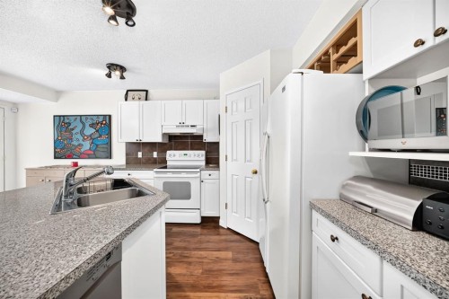 14954 Mt Mckenzie Drive Se, Calgary, AB - Indoor Photo Showing Kitchen With Double Sink