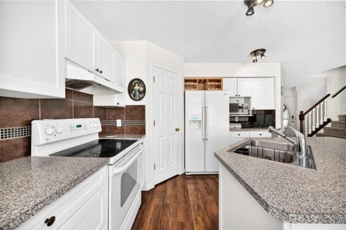 14954 Mt Mckenzie Drive Se, Calgary, AB - Indoor Photo Showing Kitchen With Double Sink