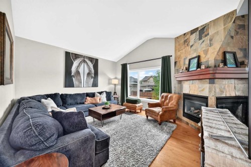11 Westridge Way, Okotoks, AB - Indoor Photo Showing Living Room With Fireplace