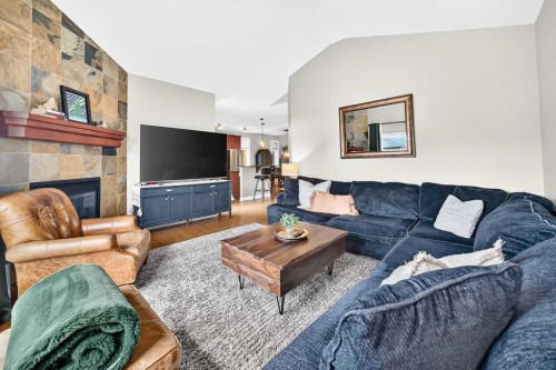 11 Westridge Way, Okotoks, AB - Indoor Photo Showing Living Room With Fireplace