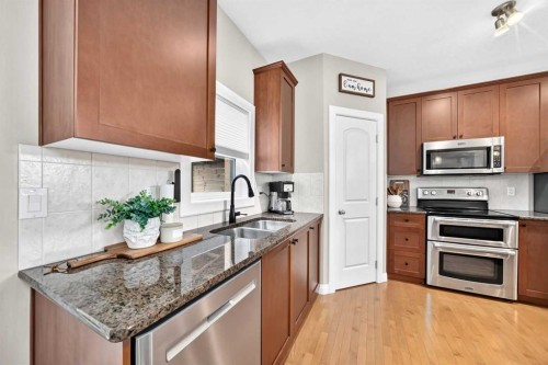 11 Westridge Way, Okotoks, AB - Indoor Photo Showing Kitchen With Double Sink