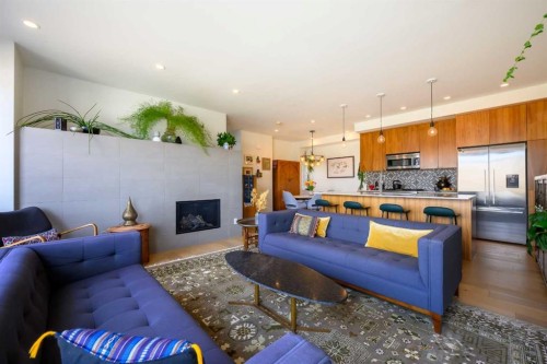 112 21 Street Nw, Calgary, AB - Indoor Photo Showing Living Room With Fireplace