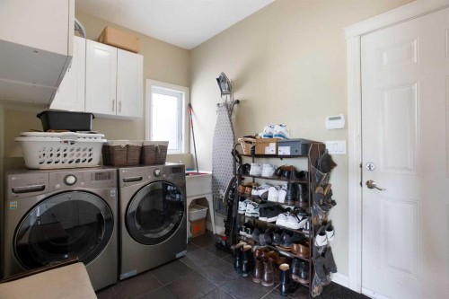 1149 Channelside Drive Sw, Airdrie, AB - Indoor Photo Showing Laundry Room