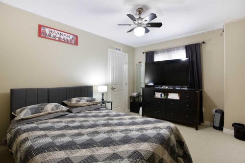 1149 Channelside Drive Sw, Airdrie, AB - Indoor Photo Showing Bedroom