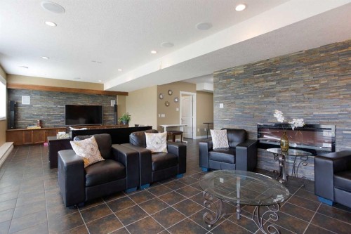 1149 Channelside Drive Sw, Airdrie, AB - Indoor With Fireplace