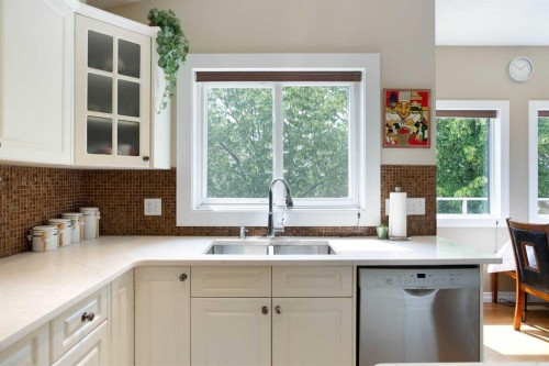 128 Waterstone Place Se, Airdrie, AB - Indoor Photo Showing Kitchen With Double Sink