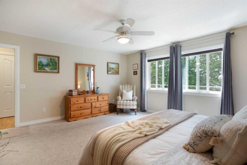 128 Waterstone Place Se, Airdrie, AB - Indoor Photo Showing Bedroom
