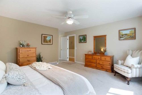 128 Waterstone Place Se, Airdrie, AB - Indoor Photo Showing Bedroom