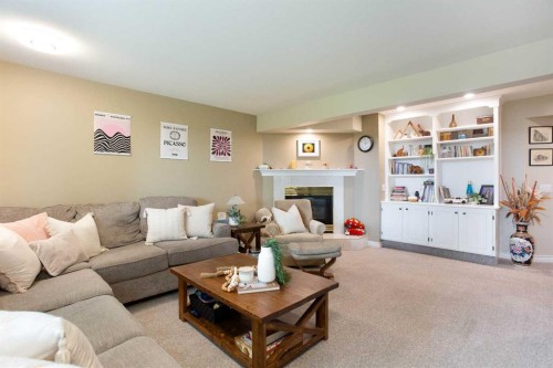 128 Waterstone Place Se, Airdrie, AB - Indoor Photo Showing Living Room With Fireplace