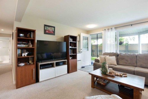 128 Waterstone Place Se, Airdrie, AB - Indoor Photo Showing Living Room