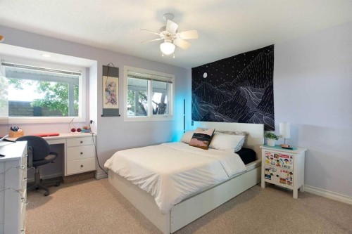 128 Waterstone Place Se, Airdrie, AB - Indoor Photo Showing Bedroom