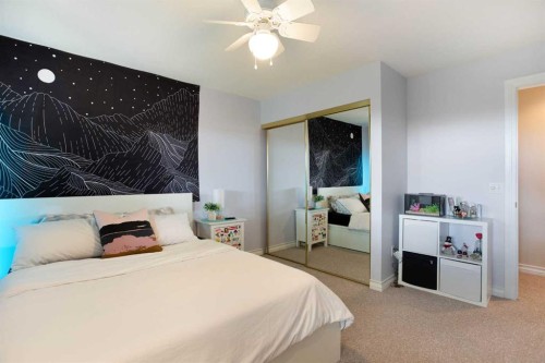 128 Waterstone Place Se, Airdrie, AB - Indoor Photo Showing Bedroom