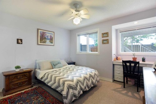 128 Waterstone Place Se, Airdrie, AB - Indoor Photo Showing Bedroom