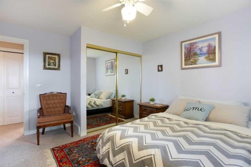128 Waterstone Place Se, Airdrie, AB - Indoor Photo Showing Bedroom