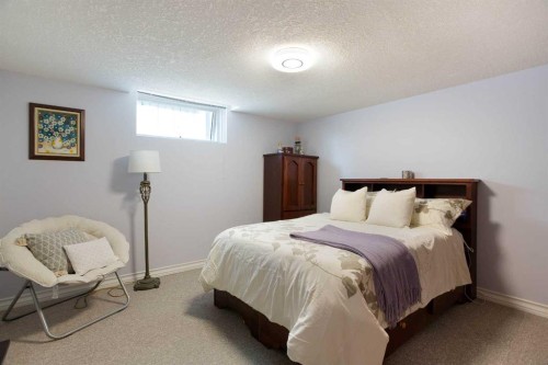 128 Waterstone Place Se, Airdrie, AB - Indoor Photo Showing Bedroom