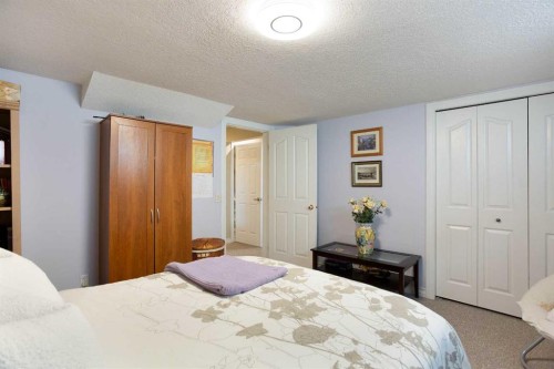 128 Waterstone Place Se, Airdrie, AB - Indoor Photo Showing Bedroom
