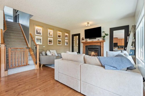 7 Crystal Green Way, Okotoks, AB - Indoor Photo Showing Living Room With Fireplace