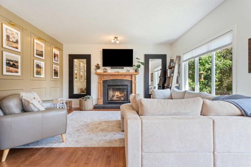 7 Crystal Green Way, Okotoks, AB - Indoor Photo Showing Living Room With Fireplace