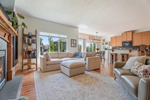 7 Crystal Green Way, Okotoks, AB - Indoor Photo Showing Living Room With Fireplace