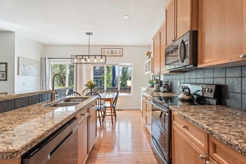 7 Crystal Green Way, Okotoks, AB - Indoor Photo Showing Kitchen With Double Sink With Upgraded Kitchen