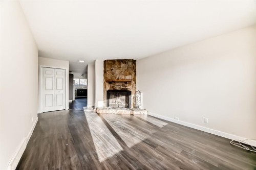 404 Acacia Drive Se, Airdrie, AB - Indoor Photo Showing Living Room With Fireplace