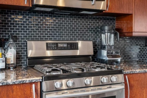 34 Cascade Place, Cochrane, AB - Indoor Photo Showing Kitchen With Upgraded Kitchen